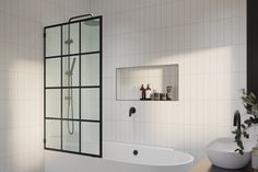 a bathroom with a tub, sink and mirror in it's center wall is shown