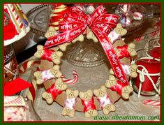 a christmas wreath made out of cookies and candy canes on top of a table