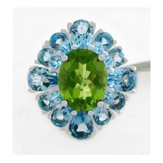 Karat : .925 Sterling Silver Gemstones : 1 Genuine Peridot - 3.15 Carats Peridot Grades, Hue . . . Olive Green Tone . . . Medium Dark Saturation . . . Vivid Cut . . . Very Good No Inclusions Or Flaws 12 Genuine Blue Topaz Total Ct Weight : 9.20 Carats Blue Topaz Grades, Hue . . . Sky Blue Tone . . . Medium Dark Saturation . . . Vivid Cut . . . Very Good No Inclusions Or Flaws Setting : Prong Shape : Oval & Pear Net Weight : 5.3 Grams Size : 7 Dimensions : 20 Mm (0.78") X 16 Mm (0.63") - Top Sett Green Multi-stone Topaz Ring For Formal Occasions, Formal Green Multi-stone Topaz Ring, Green Multi-stone Round Topaz Ring, Green Multi-stone Topaz Ring, Raw Sapphire Ring, Green Tone, Blue Tone, Pretty Earrings, Blue Topaz Ring