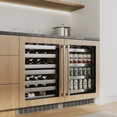 a kitchen with wooden cabinets and stainless steel appliance on the wall, along with an area rug