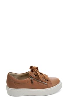 Add a classic athleisure element to your look with this well-cushioned sneaker lifted by a just-right platform. 1 1/2" platform Lace-up style; side zip closure Removable, cushioned insole Leather upper and lining/rubber sole Imported Classic Athleisure, Platform Sneaker, Nordstrom Store, Up Styles, Athleisure, Side Zip, Kids Shoes, Womens Sneakers, Rubber Sole