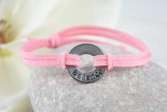 Keep your special word close at hand to motivate you!  Make a statement with your inspirational message! Metal Ring  * metal ring with word 'BALANCE' stamped on metal * affirmation ring measures approximately 7/8inch in diameter * metal piece included in the bracelet is stainless steel and nickel and lead free  Bracelet Cord * made of soft faux suede cord, and is adjustable in length   * sliding knots that always stay tied, you do not tie or untie the cord  * extend the bracelet to its maximum l Meaningful Adjustable Friendship Bracelets, Meaningful Adjustable Name Bracelet For Everyday, Meaningful Adjustable Friendship Bracelets For Everyday, Adjustable Nickel-free Name Bracelet For Everyday, Inspirational Adjustable Pink Name Bracelet, Adjustable Meaningful Bracelets For Friendship, Adjustable Meaningful Bracelet For Friendship, Adjustable Meaningful Name Bracelet For Best Friend, Meaningful Adjustable Name Bracelet For Best Friend