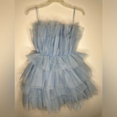 Light Blue Tulle Dress. Light Blue Puffy Dress, Light Blue Ruffled Evening Dress, Blue Tulle Mini Dress For Spring, Blue Tulle Dress For Summer, Blue Mini Tulle Dresses, Blue Prom Dress For Spring Season, Blue Prom Dress For Spring, Blue Ruffle Dresses For Party, Blue Spring Prom Dress