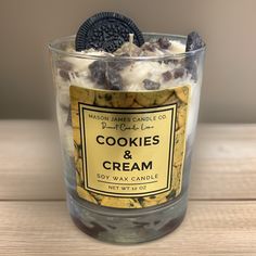 cookies and cream in a glass container on a table