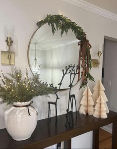 a mirror and some decorations on a table