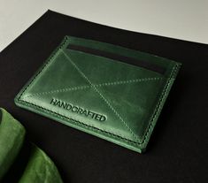 "We offer a unique custom personalized wallet with your initials! This green leather cardholder is a minimalist alternative to bulky wallets and perfect for those looking to brings a few cards and maybe some folded cash. Its comfortable design is great for daily use! It can become the best gift for someone you love. It's a lovely Mother's Day Gift idea :) PRODUCT FEATURES ♦CONTENT : - 3 card pockets which can hold 6-9 cards - 1 cash pocket ♦Wallet measures : -8 x 11 cm -or 3.32 x 4.6 inches ♦Pre Green Handmade Card Holder For Everyday Use, Green Rfid Blocking Card Holder Gift, Green Wallets With Card Slots For Gift, Green Wallets With Card Slots As A Gift, Green Rectangular Card Holder For Personal Use, Modern Green Bifold Card Holder, Green Bifold Card Holder As Gift, Classic Green Wallets As Gift, Green Wallet With Rfid Blocking As A Gift