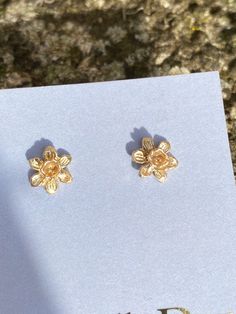 A pair of solid gold tiny daffodil earrings, beautiful little miniature studs cast from an original hand carved Victorian flower design. The earrings are perfect for that Spring feeling after a long winter, very floral, fitting the botanical trend at the moment. Tiny floral studs are all the rage. Perfect for every day wear, the studs have lovely hand crafted solid posts and backs and every single one is handmade in my Devon studio. These little English country garden daffodils are really sweet, Yellow Gold Flower Earrings For Gift, Yellow Gold Flower Earrings As Gift, Gold Flower Earrings With 3d Flowers, Yellow Gold Birth Flower Earrings Gift, Yellow Gold Birth Flower Earrings, Tiny Flower-shaped Earrings For Gift, Tiny Flower Earrings As A Gift, Tiny Flower Earrings For Gifts, Dainty Gold Earrings With 3d Flowers