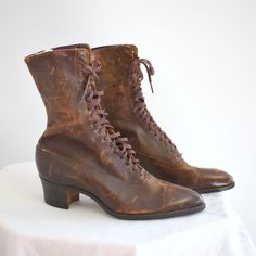 "Antique Edwardian/Victorian brown leather lace up boots.  The leather is so soft and supple -- there is no cracking or tearing; the leather just has marks and surface scuffs (no gouges).  The leather soles are in excellent condition, with very little wear, other than some sticker residue.  The tops of the inside lining is purple satin, and it is starting to shred some.  The rest of the lining is a cotton canvas.  The heels are stacked wood, and are around 1 3/4\" tall.  The boots are 10\" from Orphan Boots, Victorian Leather Boots, Brown Victorian Boots, 1950 Boots, Vintage Boots Aesthetic, Vintage Lace-up Boots With Snip Toe And Leather Sole, Vintage Lace-up Boots With Cap Toe And Leather Sole, Vintage Lace-up Boots With Leather Sole For Fall, Vintage Leather Sole Lace-up Boots For Fall