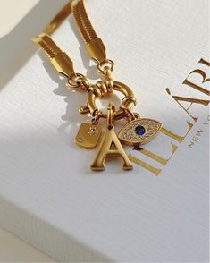 Add a touch of sunshine to your jewelry with the Star Sun Tag Charm. Features Zirconia crystal, a striking design with a sunburst pattern that catches the light for a sparkling, elegant touch. Compatible with our Build Your Own Necklaces & multi charm chain click here 18k gold plated stainless steel 10 by 5mm hypoallergenic- no green skin 1 year warranty Sold as 1 piece Luxury Star Charm Necklace, Luxury Star Charm Necklace Gift, Luxury Star Charm Necklace For Gift, Luxury Round Star Charm Jewelry, Pearl Collection, Star Charms, Stars And Moon, Ring Bracelet, Sales Gifts