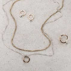 The ellipse form and circle come together in an arrangement that suggests a shell, a pearl or the symbol of Venus, creating a striking charm necklace that you'll love wearing everyday. This combination is timeless with the mixed metal elements of the gold hammered circle and silver ellipse form which slides along the glittering box chain. The charm is 5/8" long and 1/2" wide. This necklace has a 2" adjustable station so you may easily adjust the lengths. The model is shown wearing the 16/18" at Silver Jewelry In 14k Gold With Circle Shape, Everyday White Gold Open Circle Jewelry, Everyday Rose Gold Circle Jewelry, Modern Tarnish Resistant Oval Pendant Jewelry, Modern Tarnish-resistant Oval Pendant Jewelry, Rose Gold Sterling Silver Circle Jewelry, Minimalist Rose Gold Open Circle Jewelry, Modern Necklace With Round Pendant And Spring Ring Clasp, Modern Circular Rose Gold Jewelry