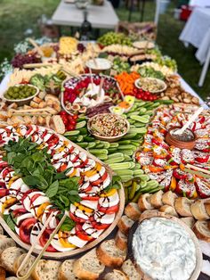 a table full of food and dips on it