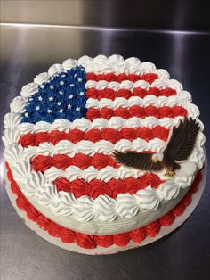 a cake decorated with an american flag and an eagle