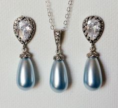 Wedding Light Blue Blush Blue Teardrop Pearl Silver Earrings and Pendant Necklace Bridal Jewelry Set with .925 Sterling Silver Chain. PLEASE READ ITEM DESCRIPTION and SHOP POLICIES before placing your order, and contact me with any questions! CHAIN is 18 inches (45.7cm) long. EARRINGS are about 1.22 inch (3.1cm) long from top of earring stud to bottom. PENDANT is about 1.06 inch (2.7cm) long including bail. PEARLS are 15x8mm. BRIDAL NECKLACES SECTION: https://www.etsy.com/shop/LanaChayka?ref=seller-platform-mcnav§ion_id=11638944 JEWELRY SETS SECTION: https://www.etsy.com/shop/LanaChayka?ref=seller-platform-mcnav§ion_id=18873488 BRIDAL JEWELRY SETS SECTION: https://www.etsy.com/shop/LanaChayka?ref=seller-platform-mcnav§ion_id=25839214 Elegant and timeless, this beautiful jewelry set is perf Blue Pearl Drop Jewelry For Wedding, Elegant Light Blue Wedding Necklaces, Light Blue Crystal Wedding Jewelry, Nickel-free Blue Necklaces For Wedding, Blue Pearl Wedding Earrings, Fine Jewelry, Pearl Wedding Jewelry Sets, Blue Pearl Earrings, Bridal Jewelry Pearl Sets, Blue Wedding Jewelry