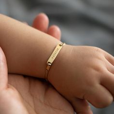 Dainty solid gold tiny Diamond-cut Figaro link bracelet for babies. Fits ages 6 months to 4 years Solid 14K Gold Name Plate 0.8x0.2in(20x4mm) Italian chain, width 1.2m Adjustable length 4.5in(6-12 months)-5.25in(1-4 years) Laser Engraving, ships out 2-3 business days Handcrafted in NYC #BS023 Gold Baby Bracelet, Gold Name Plate, Italian Chain, Engraving Fonts, Baby Bracelet, Tiny Diamond, Gold Baby, Name Plate, Diamond Cut