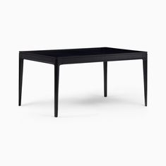 a black table sitting on top of a white floor