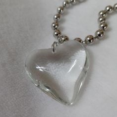 White Transparent Glass Heart Necklace Chunky Chain White Heart Necklace With Chain, Trendy Everyday Glass Necklaces, Trendy Clear Metal Jewelry, Trendy Silver Glass Necklace, Trendy Clear Jewelry With Chain, Trendy White Glass Necklaces, Trendy White Glass Necklace, Valentine's Day Clear Glass Jewelry, Clear Heart Charm Necklace