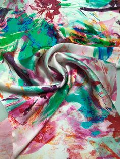 an image of a scarf with colorful paint on it