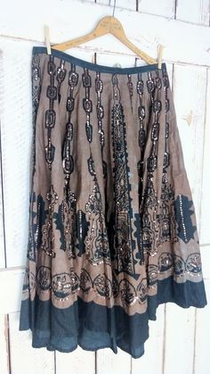 "90s vintage tribal Aztec print brown/black tie dye sequins circle skirt/sequin Indian cotton skirt/3x plus size Measurements... -marked size: 3x -waist: 40\" -length: 33\" Features... -tribal pattern throughout -subtle tie dye effect -awesome bronze sequins detail -lightweight cotton...unlined -hook and zipper closure -label: Magic Condition: -excellent vintage condition -minimal wear -a few missing sequins...unnoticeable unless looking for them PL2556" Spring Bohemian Skirt With Sequins, Fitted Bohemian Tie Dye Skirt, Bohemian Batik Print Festival Skirt, Vintage Tie-dye Tops, Fitted Bohemian Tie-dye Skirt, Bohemian Tie-dye Spring Maxi Skirt, Black Tie Dye, Tie And Dye, Indian Cotton