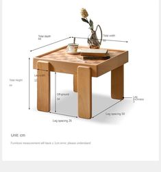 a wooden table with measurements for the top and bottom section, including an arrangement of flowers