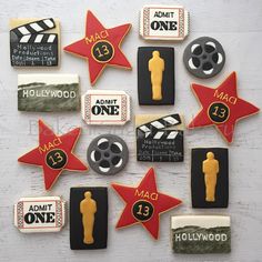 decorated cookies are arranged in the shape of hollywood stars and movie claps, including one for each character