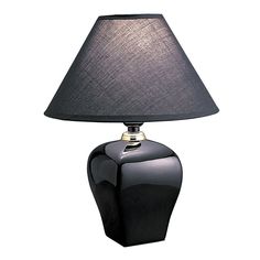 a black table lamp with a dark shade on the base and a gold trim around it