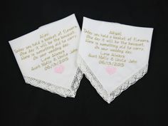 two personalized wedding handkerchiefs with hearts on them