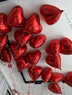 red heart shaped balloons hanging from the ceiling