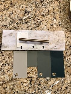 a counter top with some paint samples on it