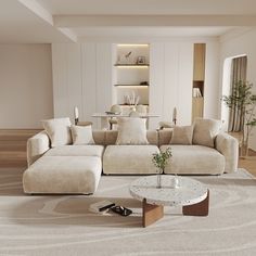 a living room filled with furniture and a white rug on top of a hard wood floor