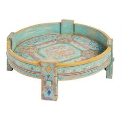 an ornately painted wooden tray with handles