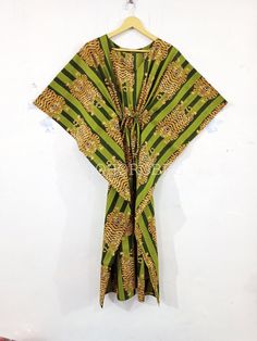 "BohoRobes Animal Printed Cotton Kaftan Dress, Cotton Summer Dress, Boho Maxi Dress, Beach Cover Up, Gifts For Her Size - Free Size Length - 44/ 48/ 52 Inches Bust/chest size - 120 CM/ 48 Inches Fabric - 100% Cotton Pattern - Tiger Print Green Tiger Print Kaftan Dress, Indian Kaftan, Cotton Caftan Dress, Long Dress, Beach Dress, Kaftan For Women, Boho Maxi Dress Kaftan has Adjustable Drawstring Waist to loose or tight , Kaftan has V Shape Neck Which is 8\" Inches Deep. Kaftan Is Multi-purpose an Tropical Green Kaftan For Beach Cover-up, Long Green Kaftan For Festival, Green Long Kaftan For Festival, Bohemian Green Kaftan With Kimono Sleeves, Green Bohemian Tunic Kaftan, Green Free Size Bohemian Kaftan, Green Bohemian Short Sleeve Kimono, Green Bohemian Free Size Kaftan, Green Free Size Festival Kaftan