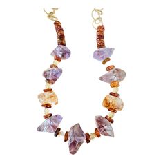 Embrace your unique style with the Bohemian In Me Collection. Featuring beautiful Amethyst, Citrine, and Amber stones on an adjustable 24k plated chain, this one-of-a-kind piece can be worn at lengths from 12 inches and extension chain up to 26 inches. Stand out from the crowd with this one-of-a-kind beauty. Stand Out From The Crowd, The Bohemian, Amber Stone, Citrine, Unique Style, Amber, Amethyst, Plating, Chain