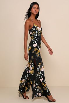 Your style will be the talk of the town when you wear the Lulus Beautiful Blooms Black Floral Print Wide-Leg Jumpsuit! Silky woven black fabric, decorated in gorgeous floral print, shapes a princess-cut bodice with adjustable crisscross straps and V-neckline. Open back and fitted waist top wide-leg pants with thigh-high slits. Hidden back zipper/clasp. Fit: This garment fits true to size. Length: Floor length. Size medium measures 54" from adjustable straps to hem. Inseam: 30.50 Front Rise: 14.0 Fitted Black Printed Maxi Dress, Fitted Printed Maxi Dress For Night Out, Black Printed Maxi Dress For Party, Black Floral Print Floor-length Maxi Dress, Black Floral Print Maxi Dress For Night Out, Floral Print Jumpsuit, Talk Of The Town, Print Jumpsuit, Adhesive Bra