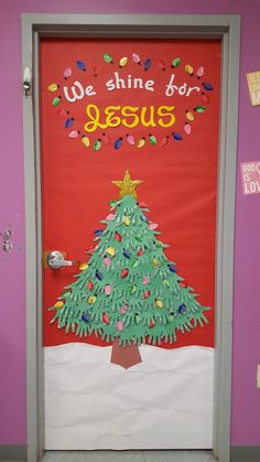 a door decorated like a christmas tree with the words we shine for jesus on it