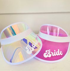 two visor hats that say bride and one with the word bridal on it