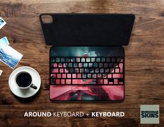 there is a keyboard and mouse on the table next to a cup of coffee with pictures around it