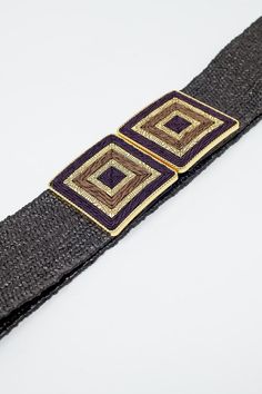 Introducing our Black Woven Belt with Square Buckle, adorned with brown and gold details – a boho-inspired accessory that effortlessly blends style and individuality. Crafted from 100% polyester, this woven belt not only exudes a bohemian charm but also ensures durability for your daily wear.  The unique design features a square buckle with intricate brown and gold detailing, adding a touch of artistry to your ensemble. The boho aesthetic of this belt allows you to express your free-spirited style, making it a versatile addition to your accessory collection.  Embracing the bohemian spirit, this belt is perfect for adding a distinctive flair to your outfits. The model is confidently wearing size U, showcasing the belt's versatility across different body types. Whether you're dressing up a f Chic Woven Belts For Beach, Chic Woven Belt For Beach, Chic Woven Belts For The Beach, Chic Brown Belt For The Beach, Chic Brown Belt For Beach, Adjustable Brown Belts For Beach, Elegant Fabric Belt For Beach, Chic Summer Vacation Belt, Elegant Fabric Beach Belt