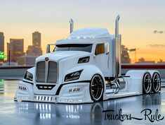 a white semi truck parked in front of a city skyline