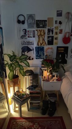 a living room filled with furniture and lots of pictures hanging on the wall above it