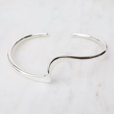 BRC Sterling Silver Cuff with Single Wave Modern Sterling Silver Cuff Jewelry, Modern Stackable Bangle, Adjustable Contemporary Cuff Bracelet, Modern Twist Polished Bangle Cuff Bracelet, Modern Sterling Silver Cuff Bracelet Bangle, Modern Cuff Bracelet With Oyster Design For Gift, Modern Adjustable Open Band Bracelets, Adjustable Modern Open Band Bracelets, Modern Adjustable Open Band Bracelet