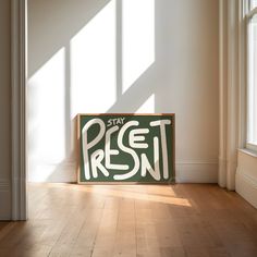 a wooden sign that says stay fresh on it in front of a window with sunlight streaming through the windows