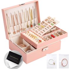 an open pink jewelry box filled with lots of necklaces