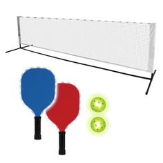 two paddles and a ball are next to a net on a white background with green balls