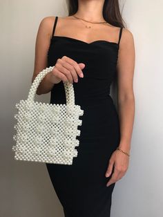 Bead bags are 100% handmade. The interior of the bag is quite large. It can fit most items, from phone to notebook. The bag will come with a special pouch. * Dimensions - Width: 17 cm - Height: 18 cm  - Depth: 10.5 cm About Bag; Apart from pearls, different beads and colors were used. Brides can use it as a handbag. * Materials - Luxury Plated Pearl * Shipping - Ships worldwide from İstanbul, Turkey. - Production time before shipment is 2-7 working days. - 2-5 business days is for USA shipment. Pearl White Bag With Pearl Handle, Pearl White Bag With Pearl Handle Rectangular, Pearl White Rectangular Bag With Pearl Handle, White Clutch Box Bag With Top Carry Handle, Square Wedding Bag With Pearl Handle, Rectangular Pearl White Shoulder Bag, Pearl White Handmade Rectangular Evening Bag, White Rectangular Bag With Pearl Handle, White Rectangular Evening Bag With Top Carry Handle