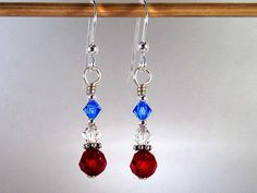 "These patriotic earrings which I call Patriot are made with siam (red), sapphire (blue) and clear (white) top quality name brand crystals, bali silver and sterling silver. They dangle from sturdy sterling silver french hook earwires and measure 1.5\" from the top curve of the earwire to the bottom of the faceted round crystal. What a great way to show your love of country or of all things nautical and still satisfy your love of bling! Please feel free to ask me any questions you may have about Silver Jewelry For 4th Of July Gift, Silver Jewelry Gift For 4th Of July, Patriotic Silver Dangle Earrings, Patriotic Blue Dangle Jewelry, Patriotic Drop Earrings Jewelry Gift, Patriotic Dangle Jewelry For Gifts, Silver Dangle Patriotic Earrings, Blue Ear Wire Jewelry For 4th Of July, Handmade Patriotic Silver Jewelry