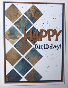 a card with the words happy birthday written in brown and blue ink on it,