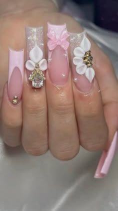 a woman's hand with pink and white nails