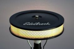 a close up of a light on top of a black pole with the word stillbook written on it