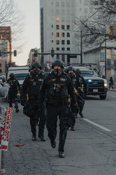 a group of police officers walking down the street