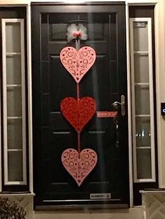 two hearts are attached to the front door